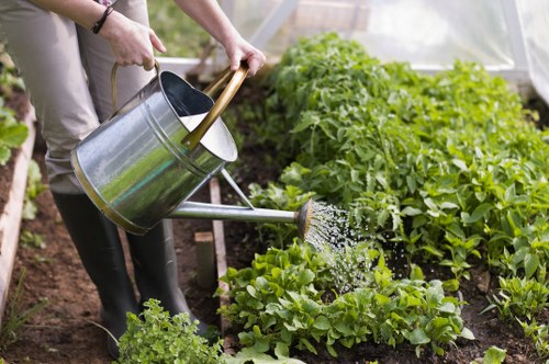 Worker wearing PPE during insured garden waste clearance